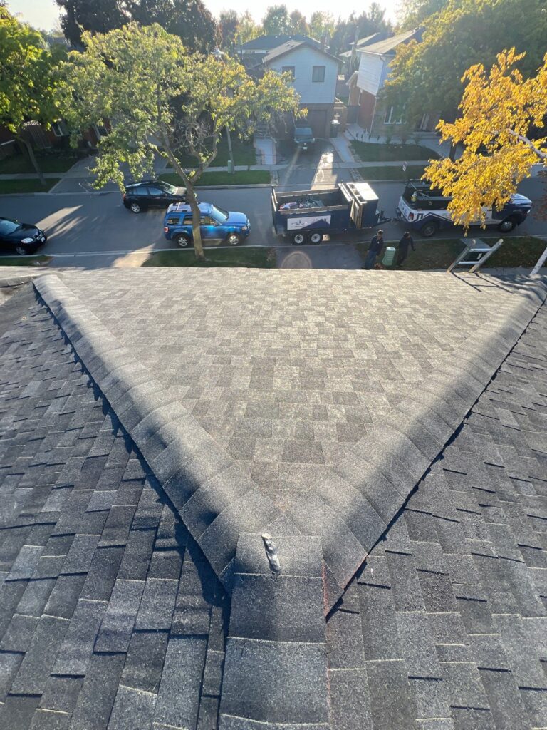 Hip ridge on a new grey shingle roof